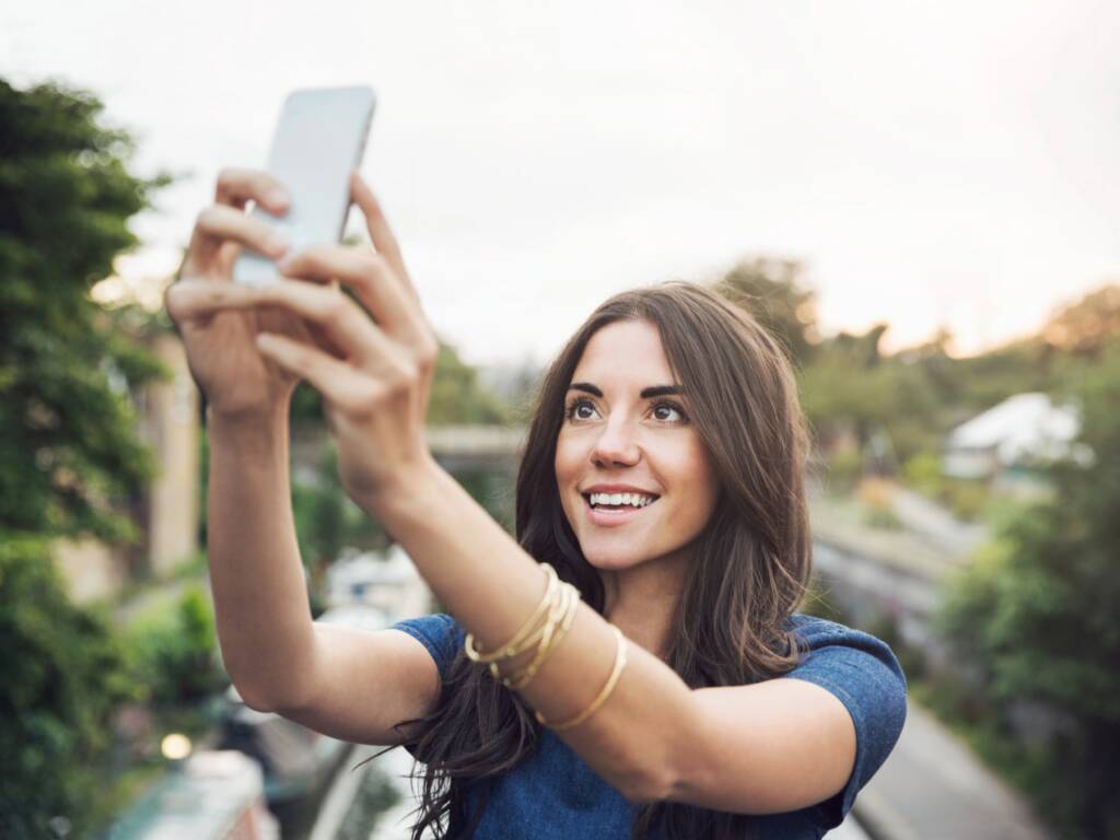 A woman taking a selfie.